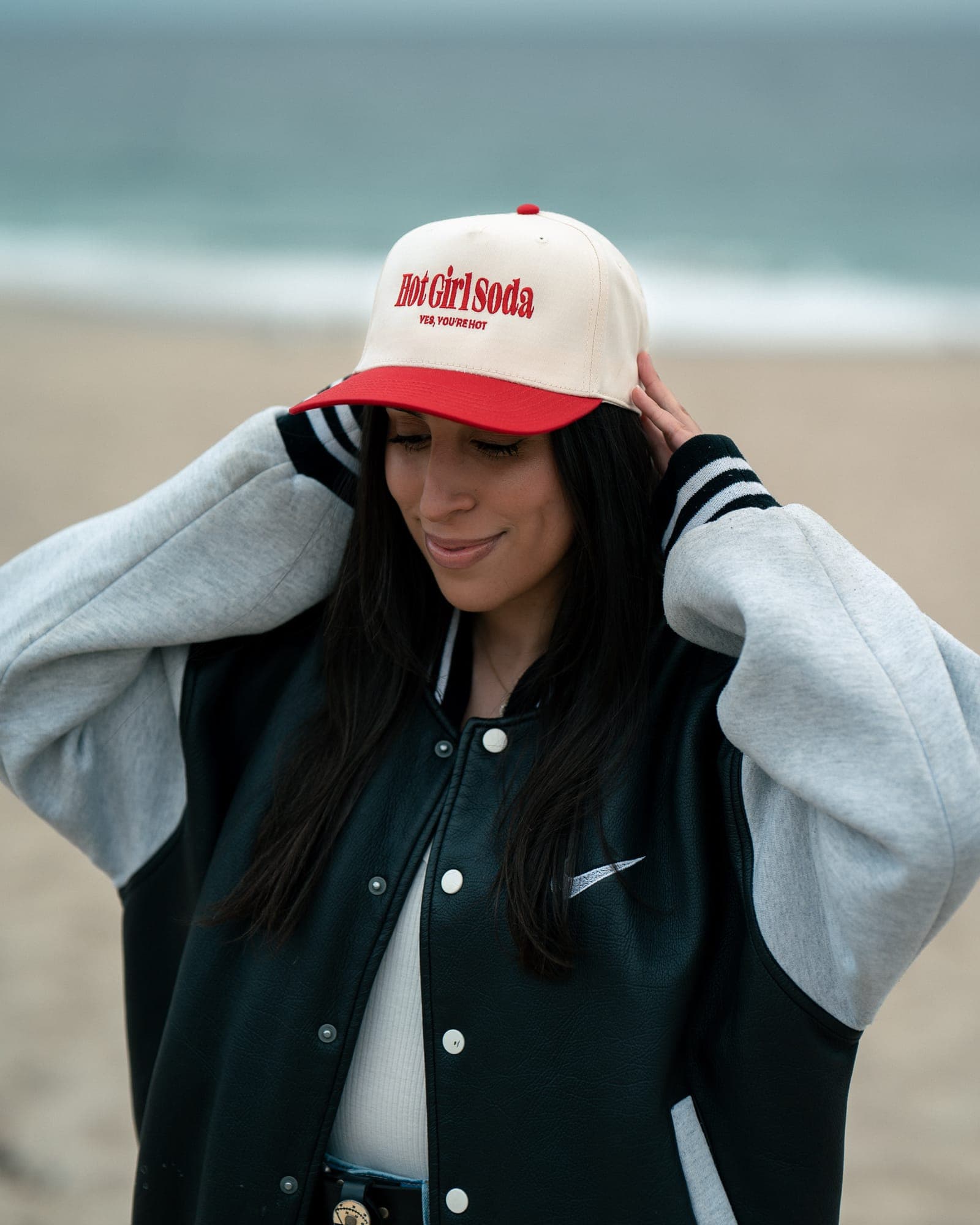 Model wearing Hot Girl Soda cap at the beach